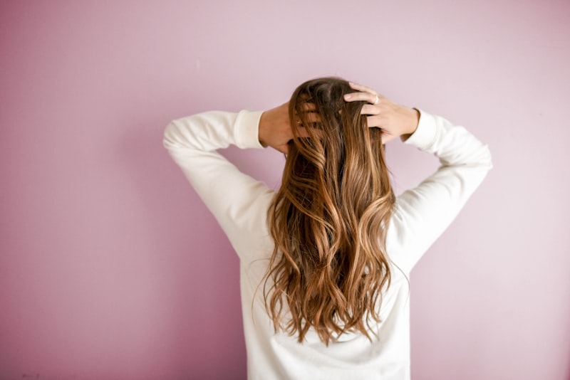 Long layered brunette haircut with soft waves